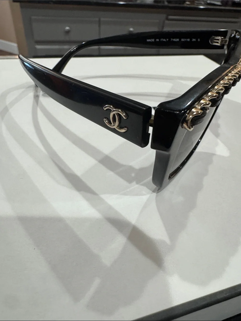 CHANEL Black Cat-Eye Sunglasses with Gold Chain Trim